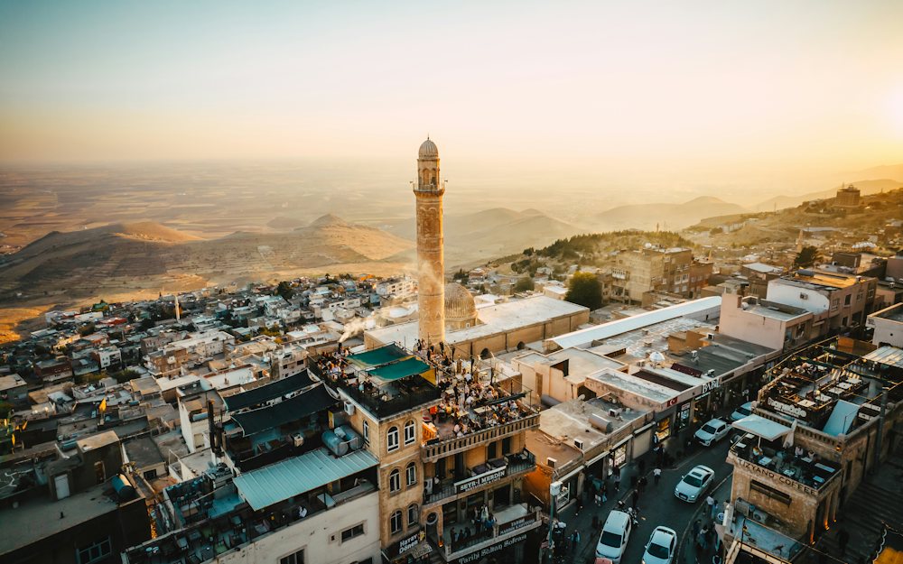 Golden-hour view over Mardin’s stone houses towards the Mesopotamian plain